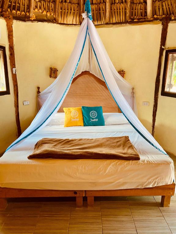 Postel nebo postele na pokoji v ubytování Cabanas Jaalkab
