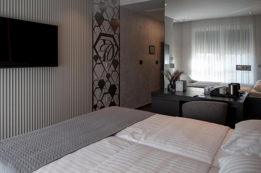 Postel nebo postele na pokoji v ubytování Diamond Hotel