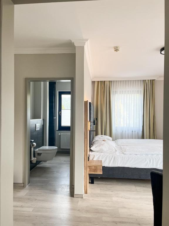 Postel nebo postele na pokoji v ubytování Hotel Paulushof
