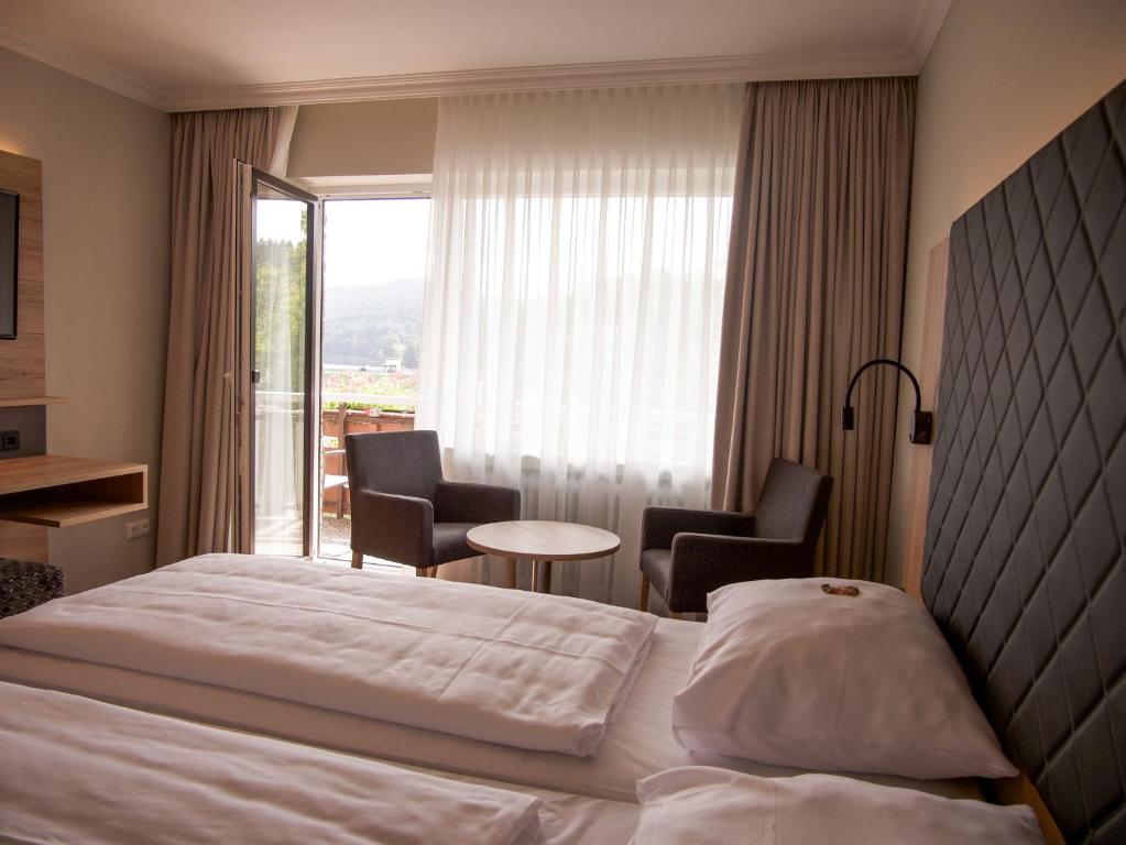 Postel nebo postele na pokoji v ubytování Hotel Paulushof