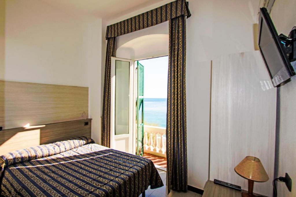 Postel nebo postele na pokoji v ubytování Hotel Baia
