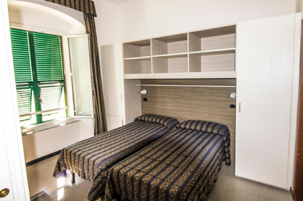 Postel nebo postele na pokoji v ubytování Hotel Baia