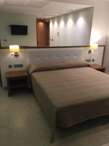Cama o camas de una habitación en Hotel Teruel