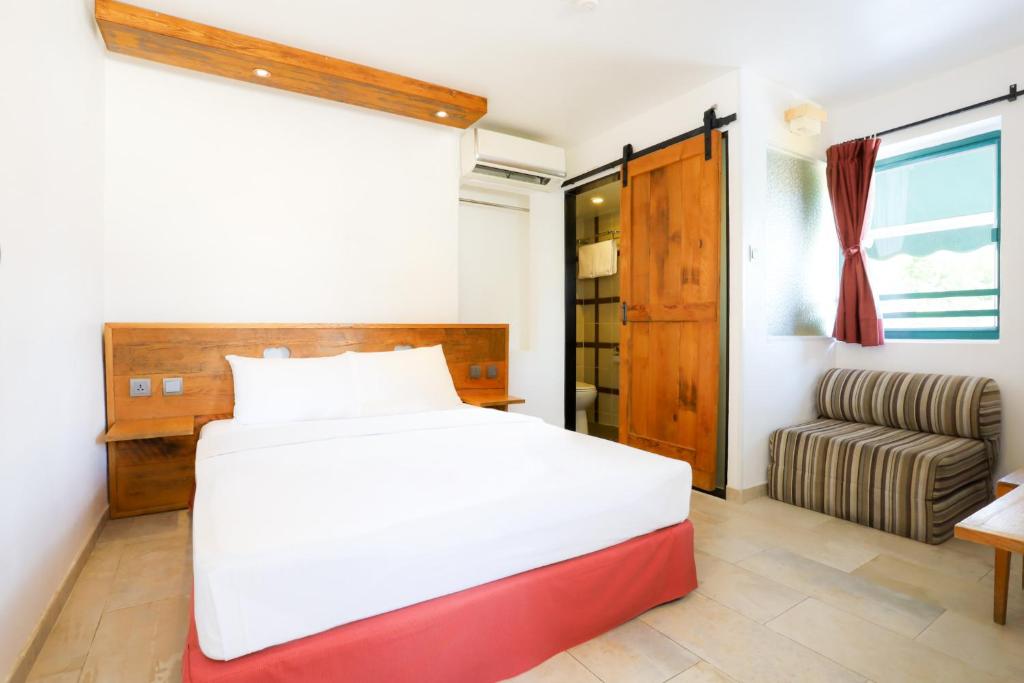 Rúm í herbergi á B & B Cheung Chau