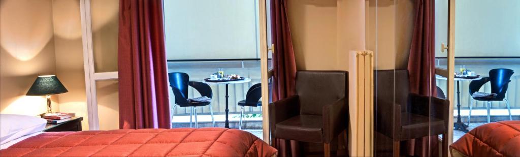 Postel nebo postele na pokoji v ubytování Nicola Hotel