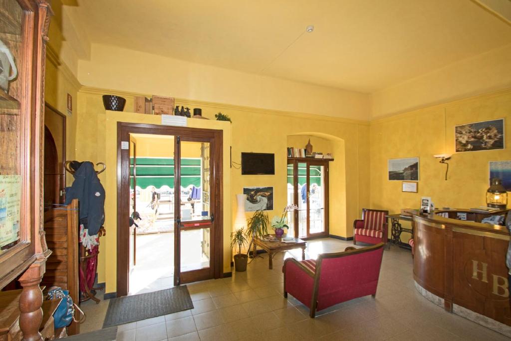 a living room with a view of the ocean at Hotel Baia in Monterosso al Mare