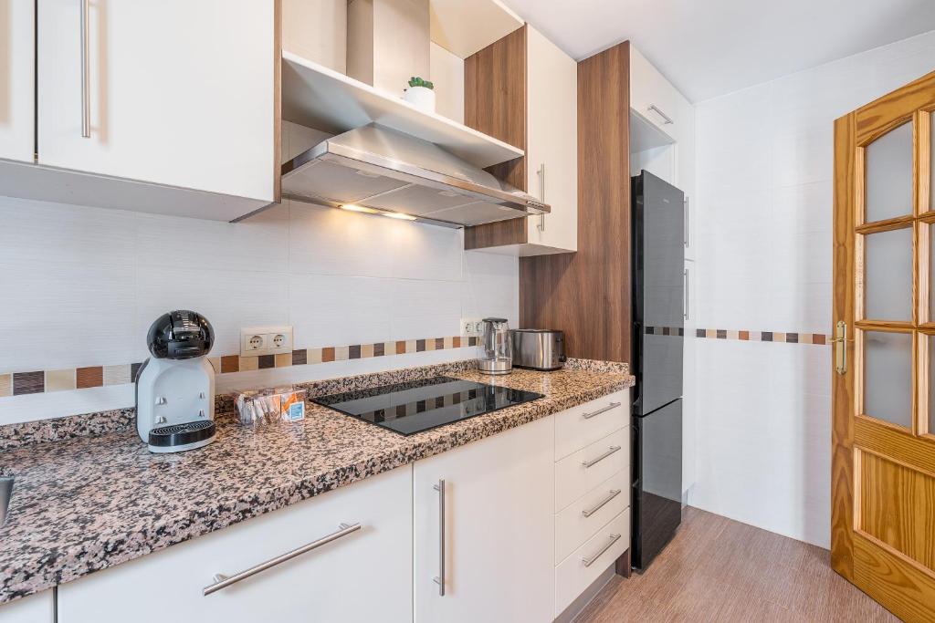 Kuchyň nebo kuchyňský kout v ubytování Apartamento Molinillo