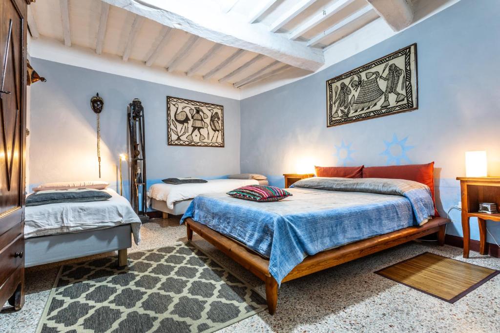 Postel nebo postele na pokoji v ubytování Le Cisterne B&B