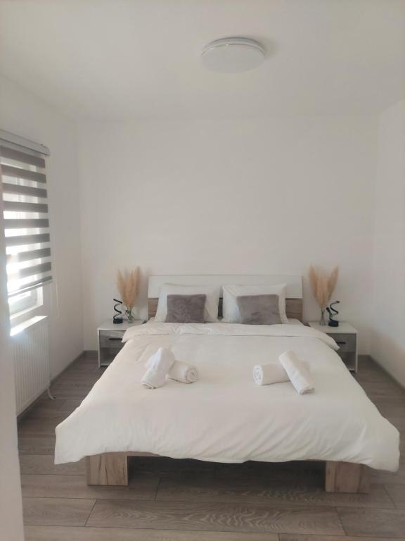 Postel nebo postele na pokoji v ubytování Apartmani Agape