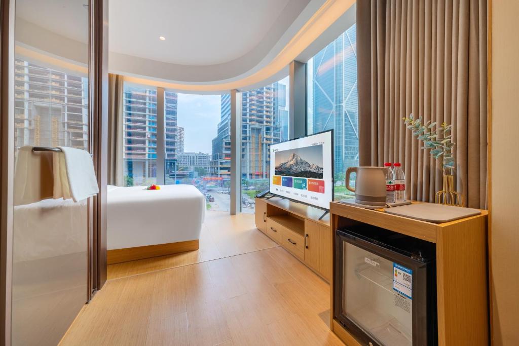 Postel nebo postele na pokoji v ubytování Yibo Hotel - Pazhou Convention and Exhibition Center - Walking distance to Canton Fair