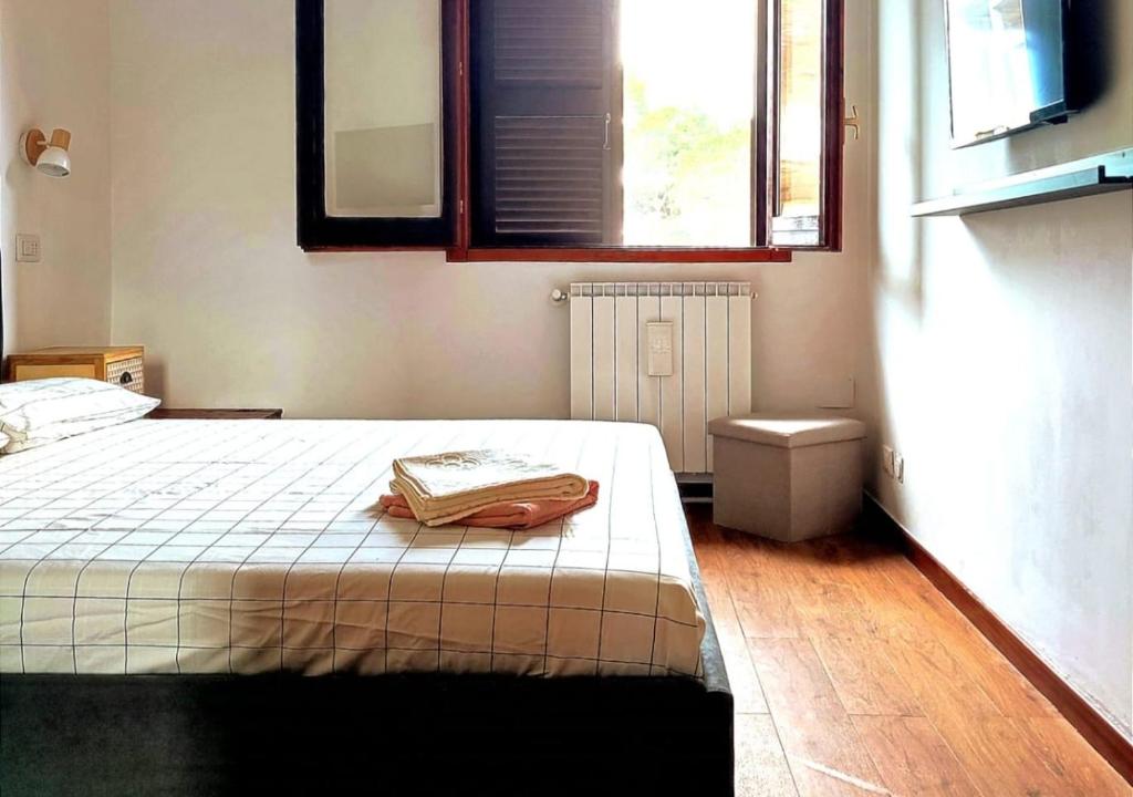 Postel nebo postele na pokoji v ubytování Giulia's Cozy Retreat