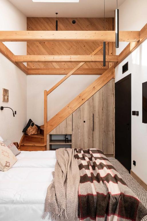 Postel nebo postele na pokoji v ubytování Stefanova Zakopane Aparthotel & Spa