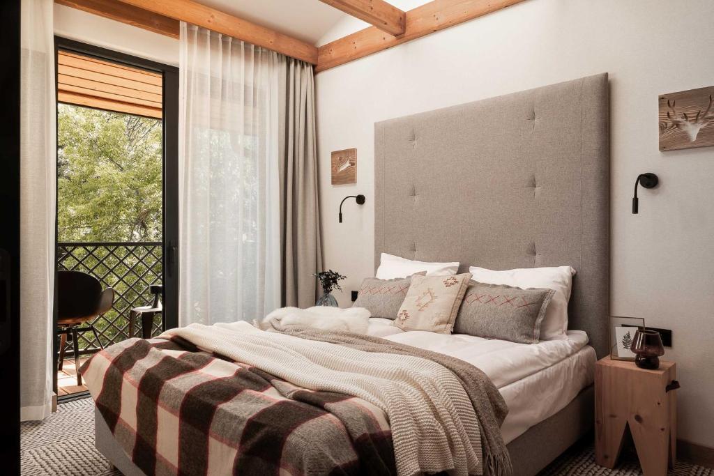 Postel nebo postele na pokoji v ubytování Stefanova Zakopane Aparthotel & Spa