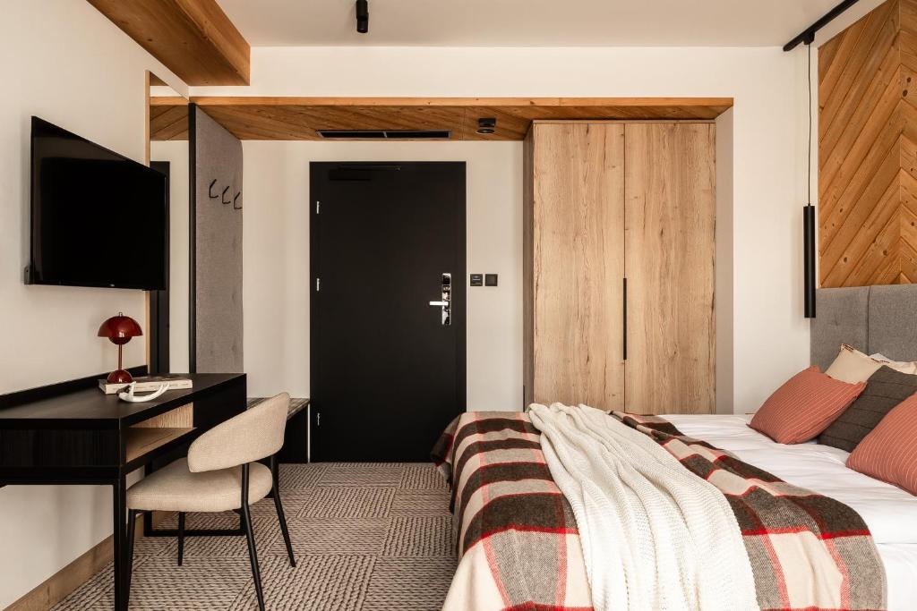 Postel nebo postele na pokoji v ubytování Stefanova Zakopane Aparthotel & Spa