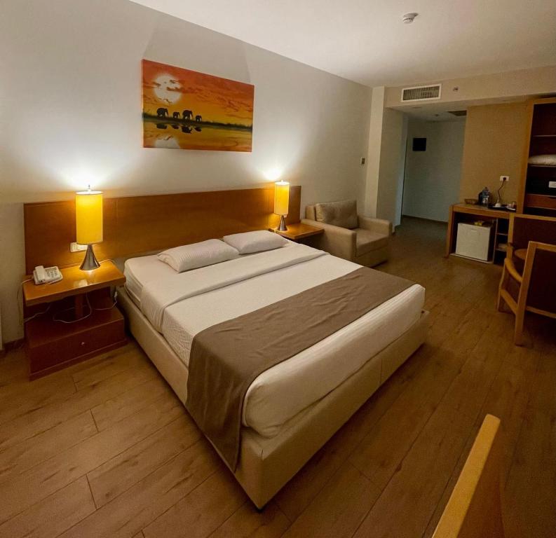 Postel nebo postele na pokoji v ubytování Caesar Hotel Ramallah