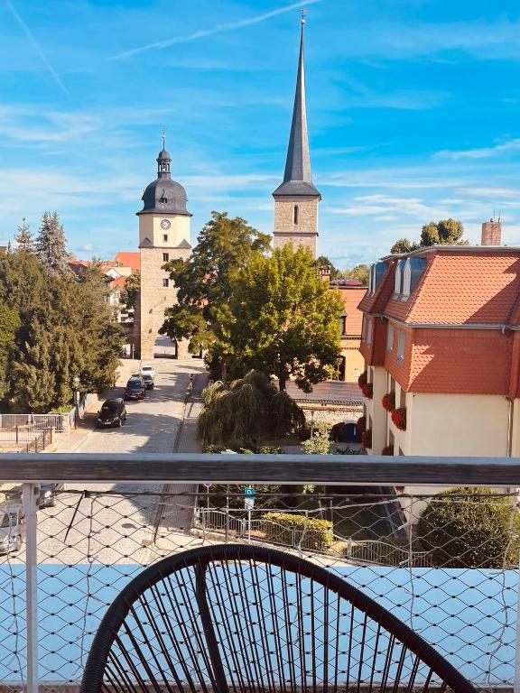 a view from a balcony of a city with a church at Penthouse Traum - Blick über Arnstadt in Arnstadt