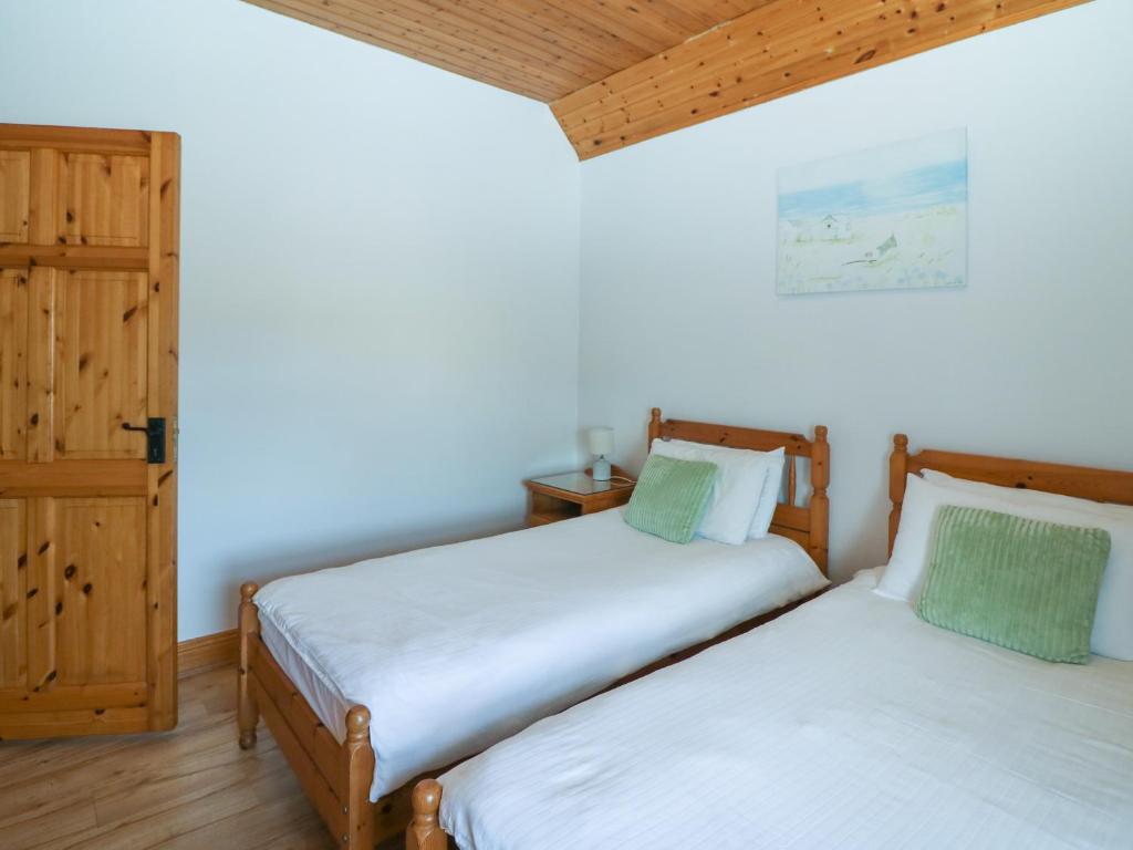 Postel nebo postele na pokoji v ubytování Rose Cottage