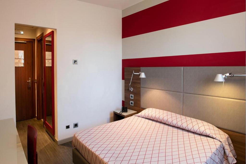 Postel nebo postele na pokoji v ubytování Hotel Del Parco