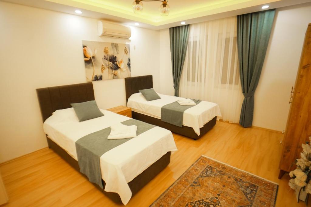 A bed or beds in a room at Villa SOLEMARE DEMRE