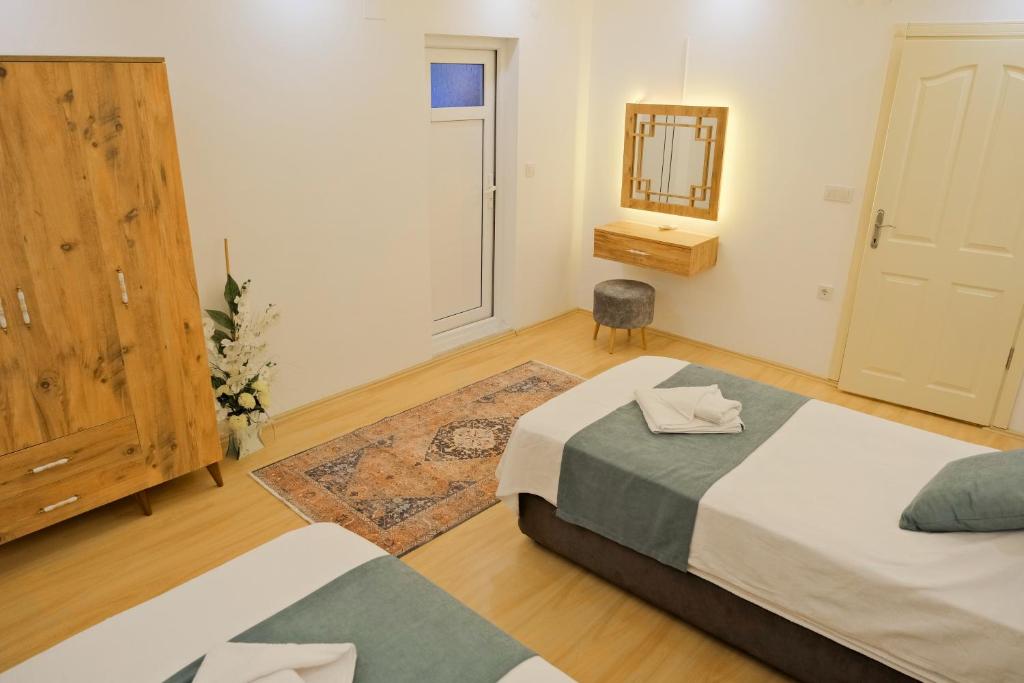 A bed or beds in a room at Villa SOLEMARE DEMRE