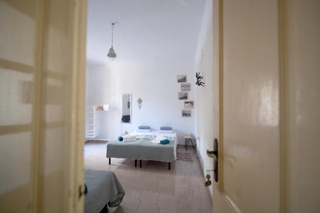 Postel nebo postele na pokoji v ubytování Safeheaven Sardinia