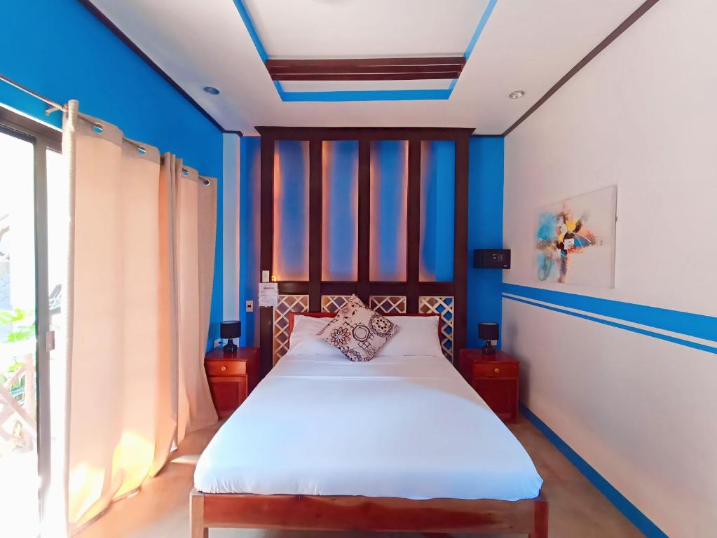 Postel nebo postele na pokoji v ubytování Hotel Oasis Port Barton