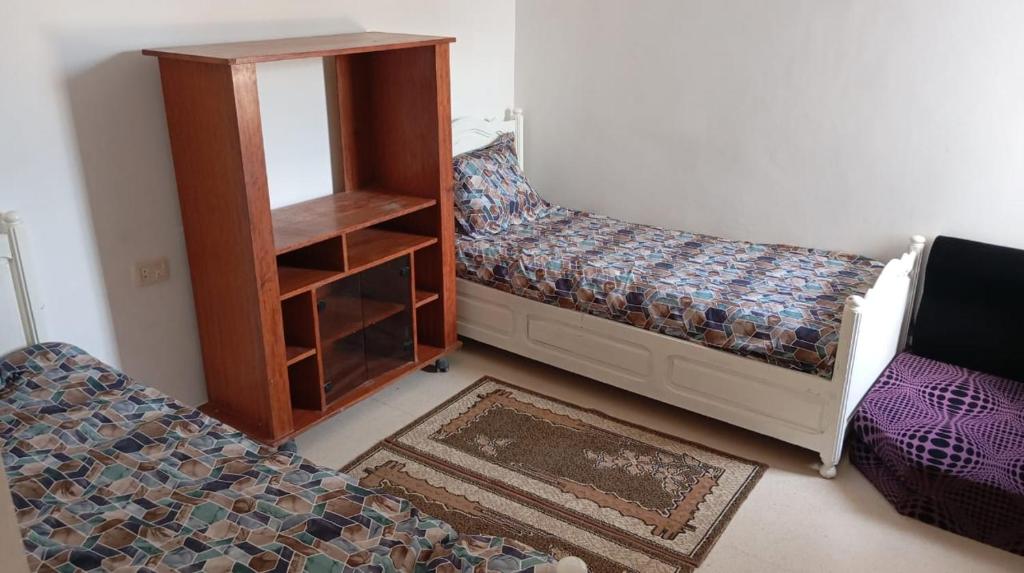 Postel nebo postele na pokoji v ubytování Studio Al Salam Djerba Midoun avec aspect architectural traditional bien fini