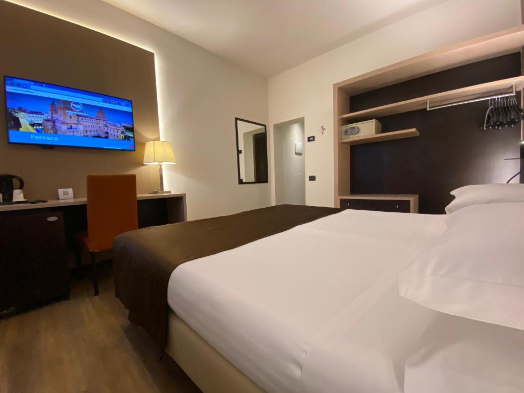 Postel nebo postele na pokoji v ubytování Hotel Carlton