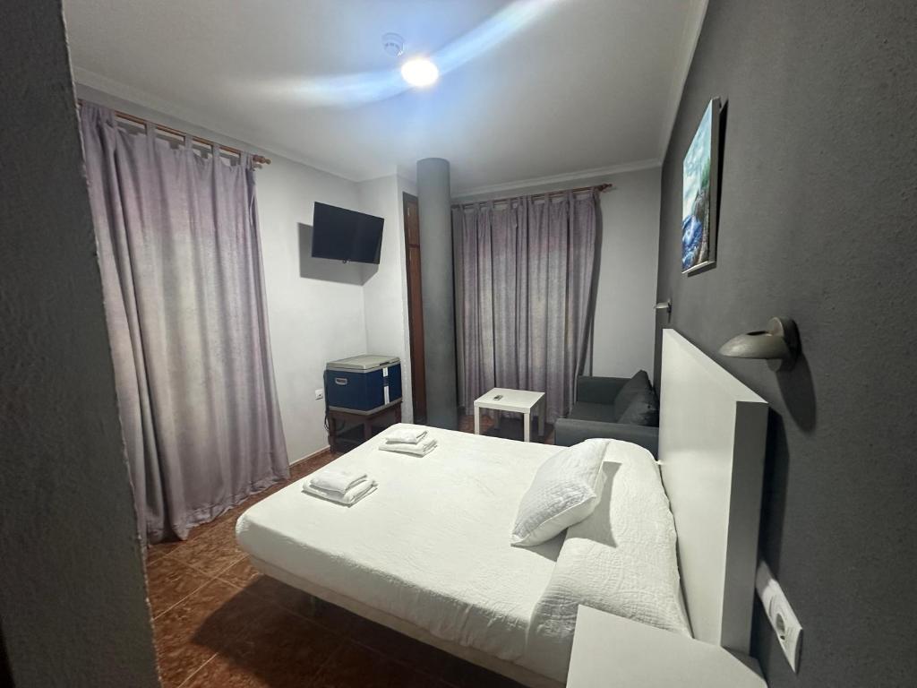 Televízia a/alebo spoločenská miestnosť v ubytovaní Apartamentos & Rooms JP