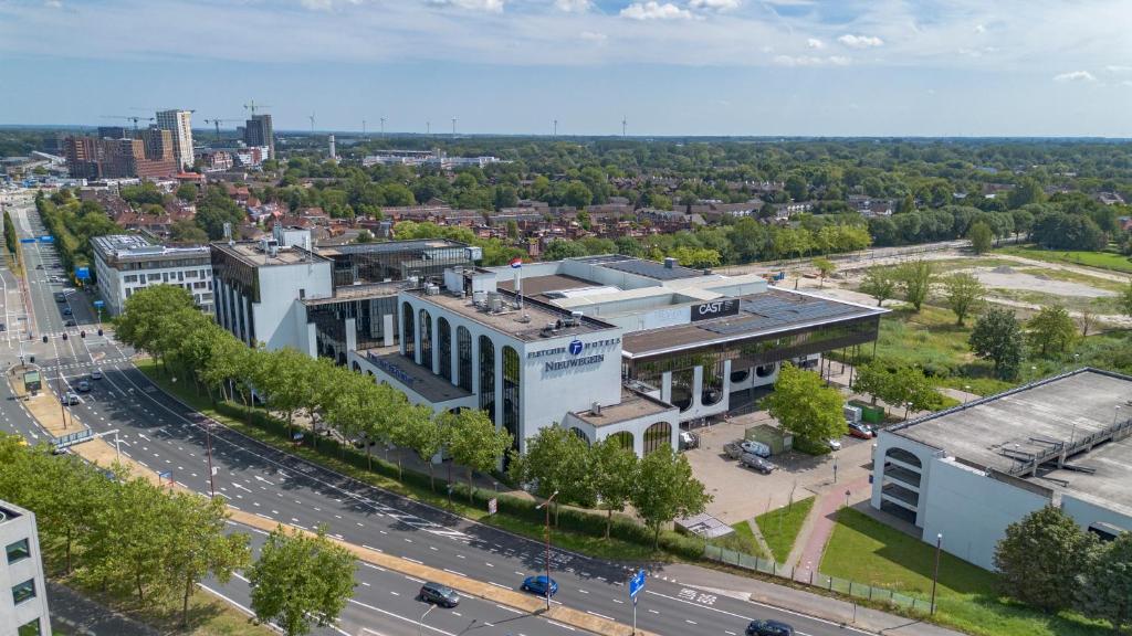 an aerial view of a city with a building at Fletcher Hotel-Restaurant Nieuwegein-Utrecht in Nieuwegein