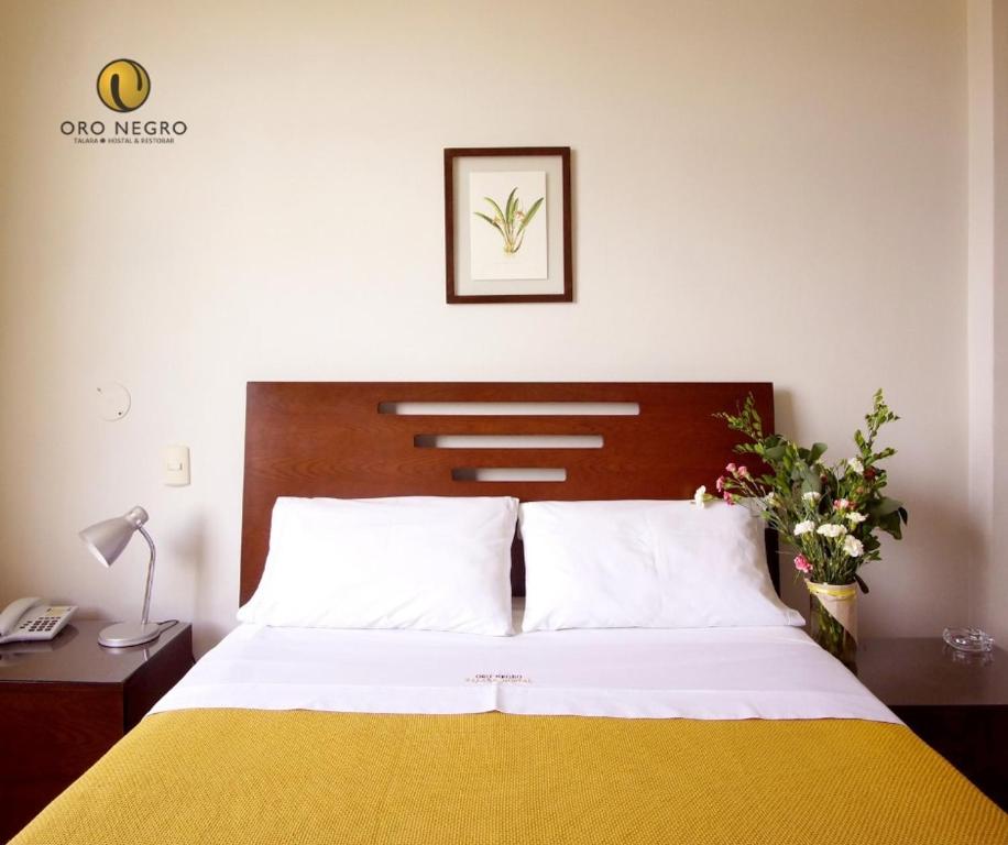 Postel nebo postele na pokoji v ubytování Hotel Oro Negro