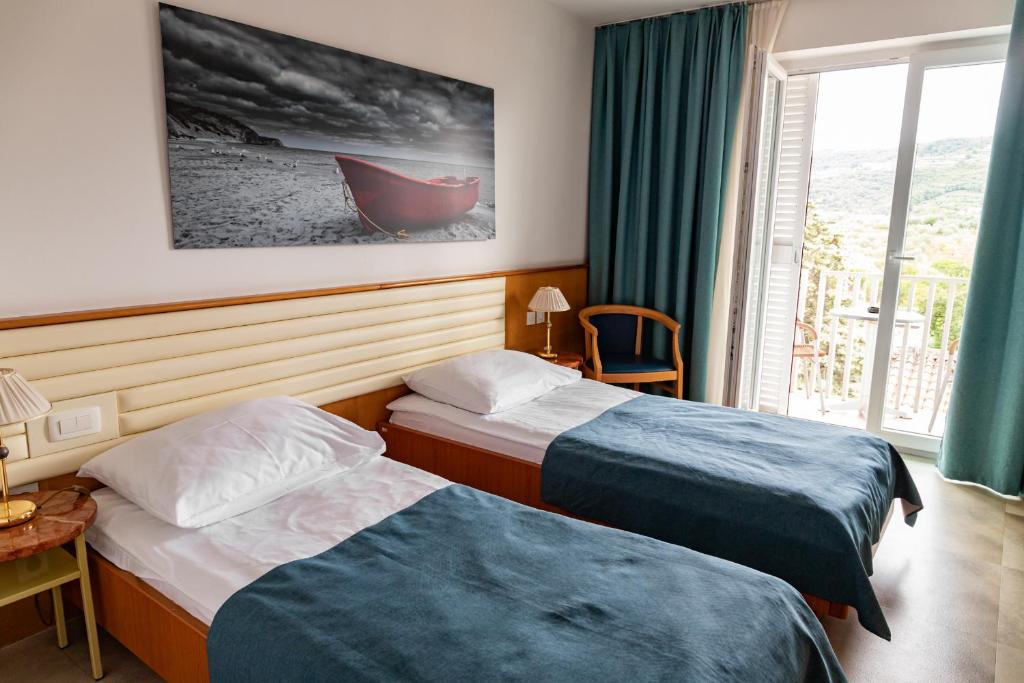 Voodi või voodid majutusasutuse Hotel Laguna - Terme Krka toas