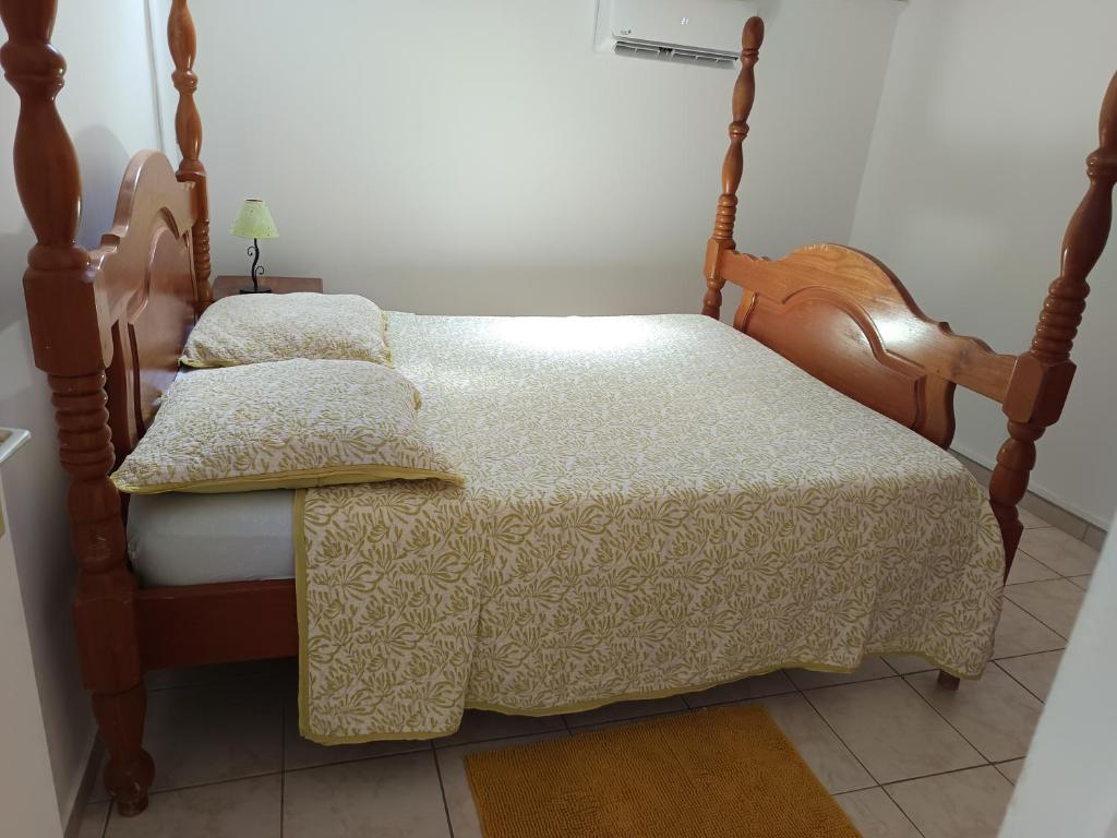 Postel nebo postele na pokoji v ubytování L'ASETA Paradise