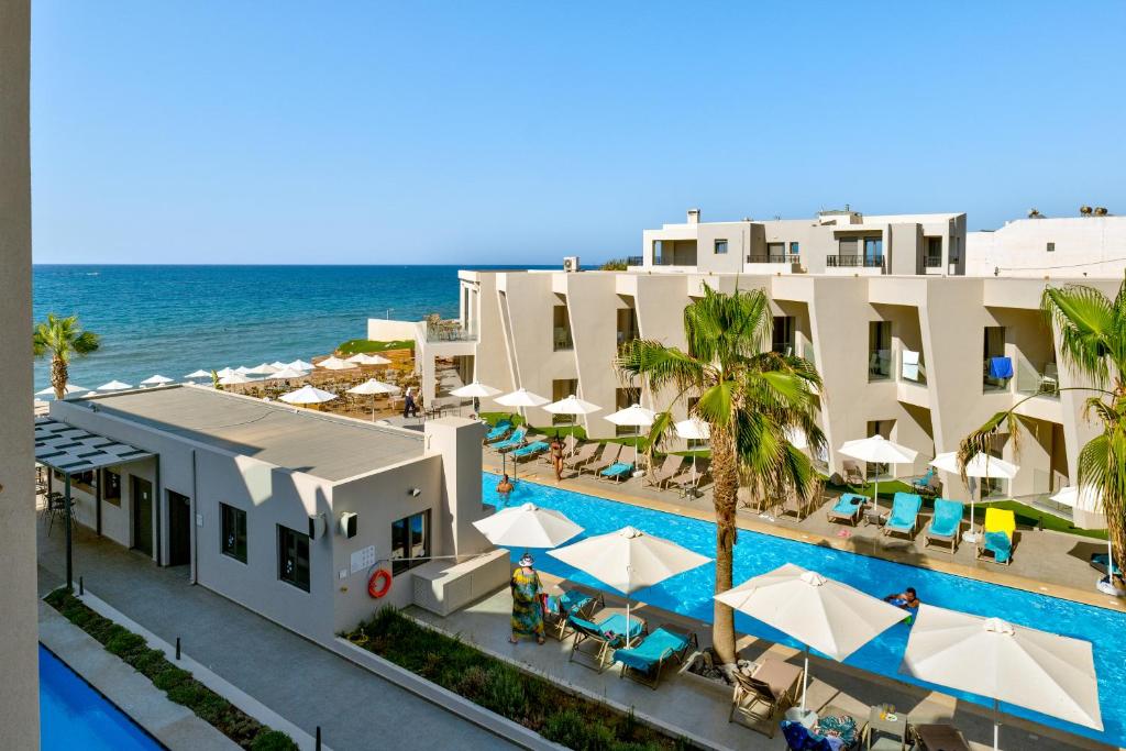 an aerial view of the hotel and the ocean at White Olive Elite Rethymno in Sfakaki