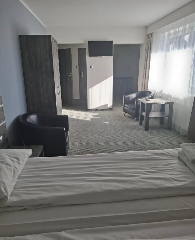 Posteľ alebo postele v izbe v ubytovaní Hotel Giżycko