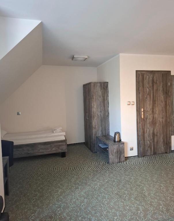 Posteľ alebo postele v izbe v ubytovaní Hotel Giżycko