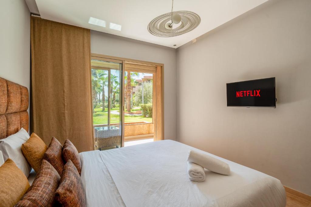 Ένα ή περισσότερα κρεβάτια σε δωμάτιο στο Elegant Apartment in Prestigia Golf Marrakech