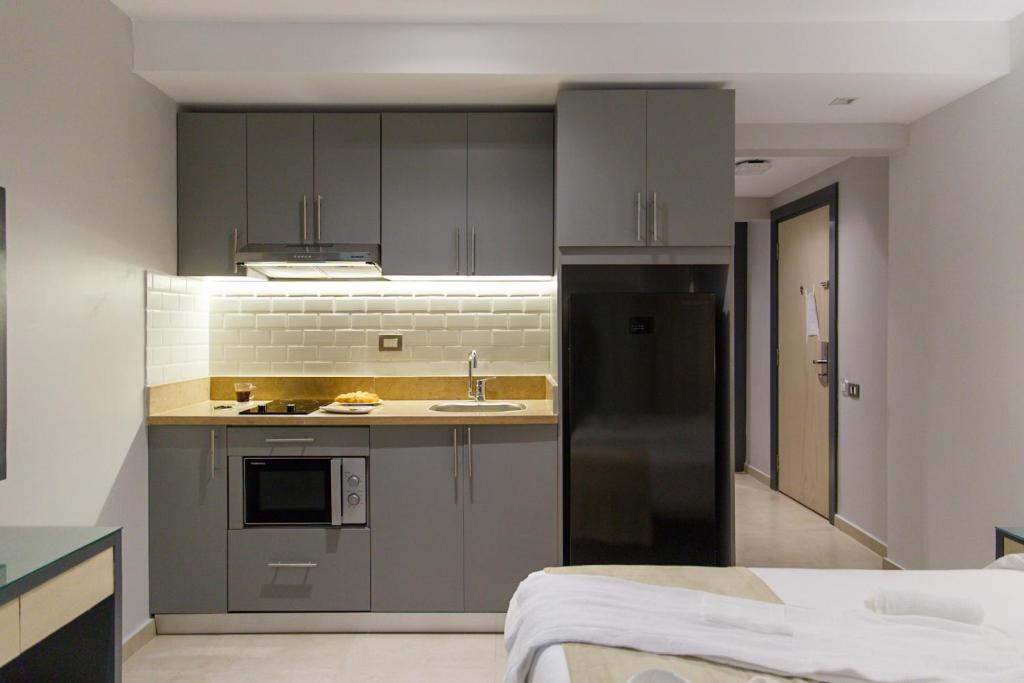 Kuchyň nebo kuchyňský kout v ubytování Rhactus House San Stefano