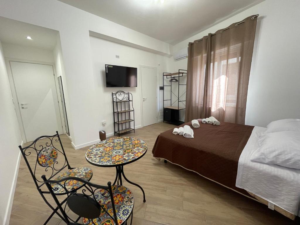 Postel nebo postele na pokoji v ubytování Bieddu Suites