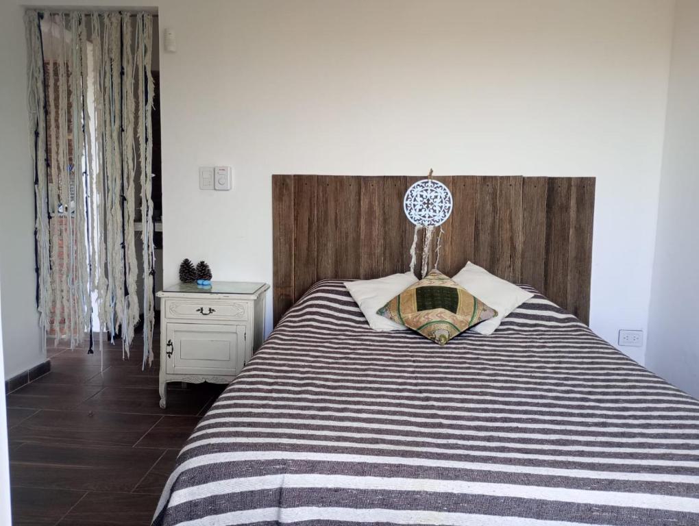 Ένα ή περισσότερα κρεβάτια σε δωμάτιο στο La Tacuarita