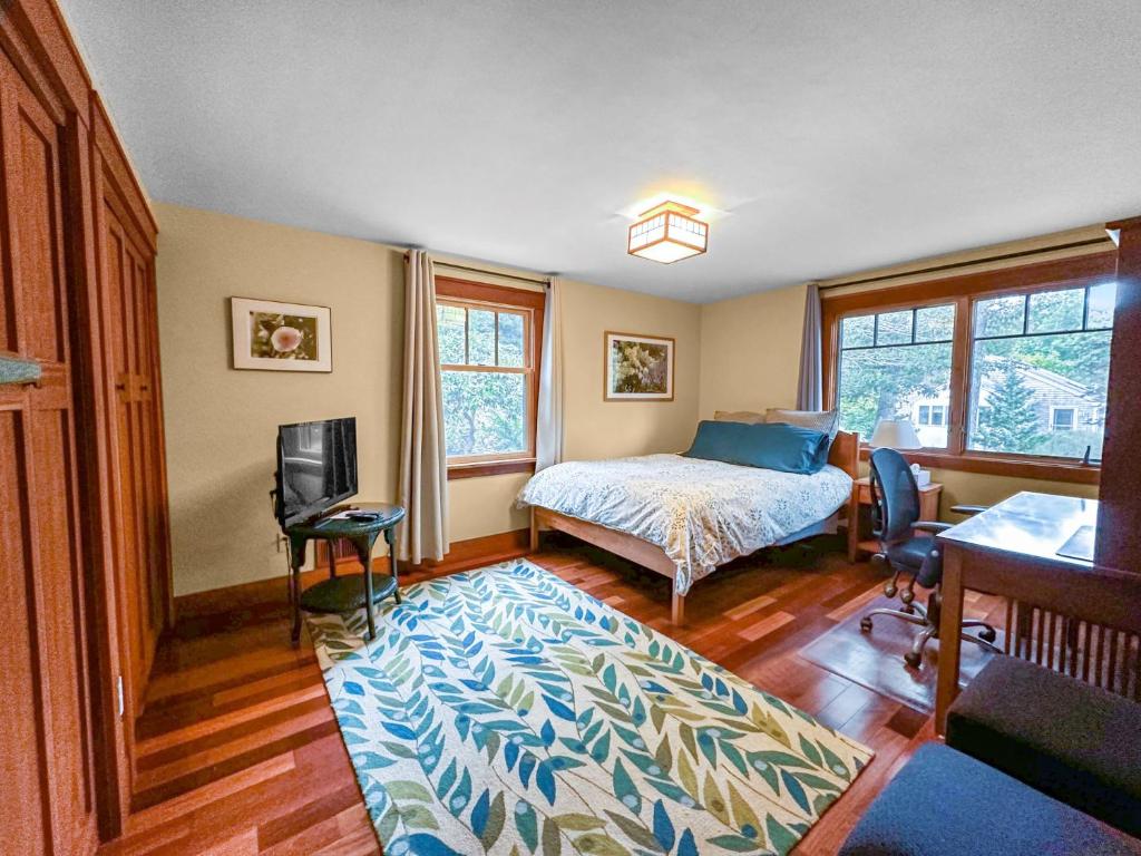 a bedroom with a bed and a tv in it at 18 Bourne Avenue Sandwich - - Cape Cod in East Sandwich