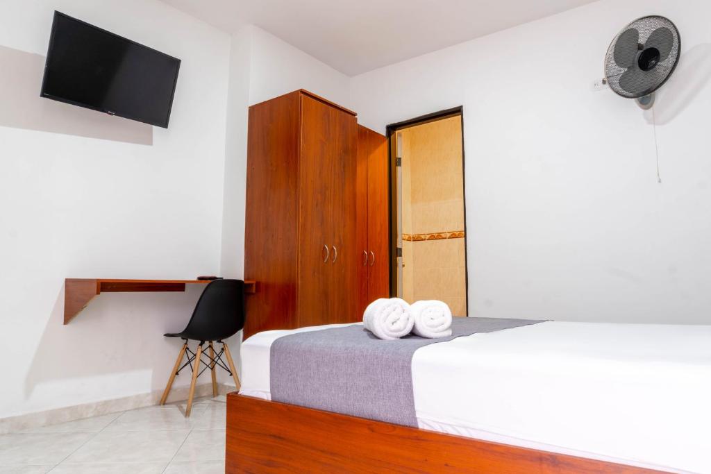 Postel nebo postele na pokoji v ubytování Ayenda 1228 Balcones de la 70