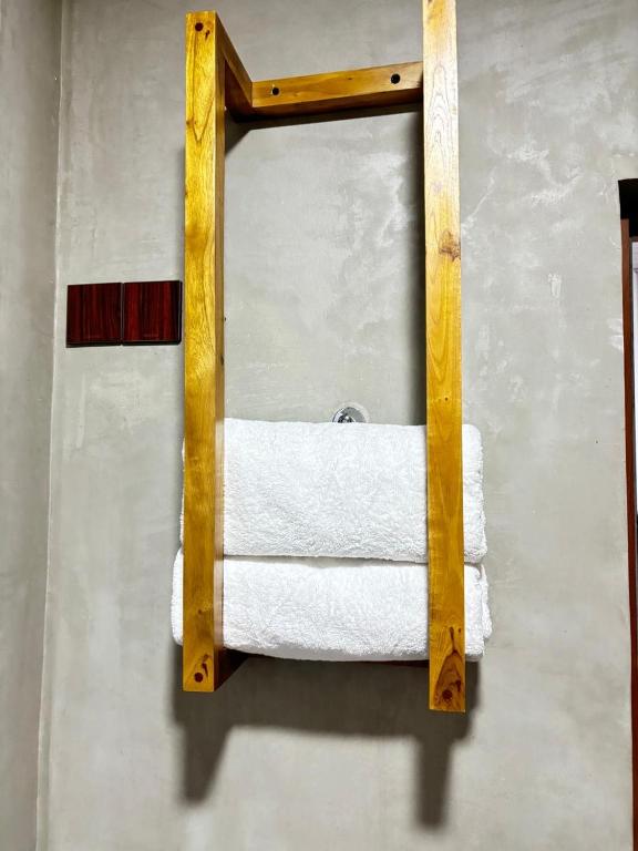 Postel nebo postele na pokoji v ubytování New Sandra Guesthouse