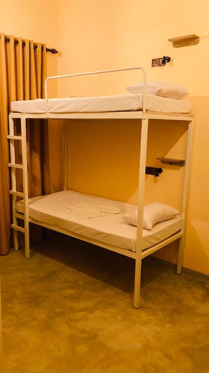Postel nebo postele na pokoji v ubytování Ayubowan Hiriketiya
