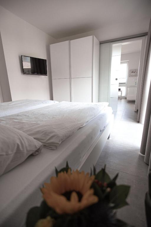 Postel nebo postele na pokoji v ubytování watn Meerblick-Nordseepark Dangast, 2Schlafzimmer,2Bäder,Kamin,Parkplatz