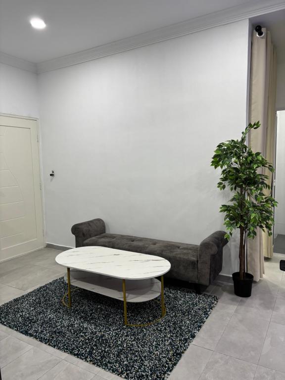 Posezení v ubytování Idaman Cottage Sekinchan