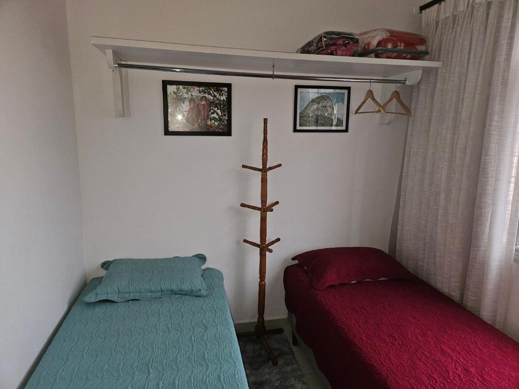 Postel nebo postele na pokoji v ubytování casa duplex sergio e claudia