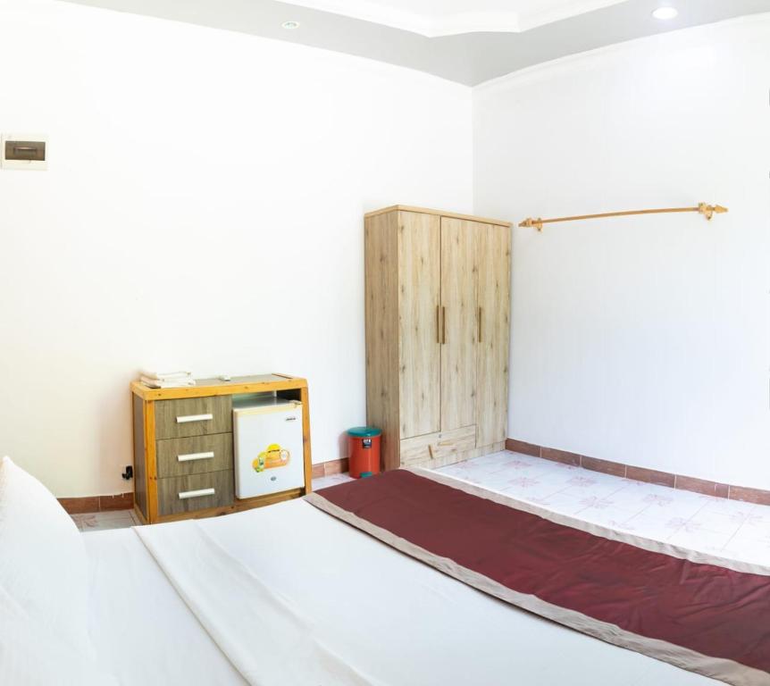 Postel nebo postele na pokoji v ubytování Coquillage Inn
