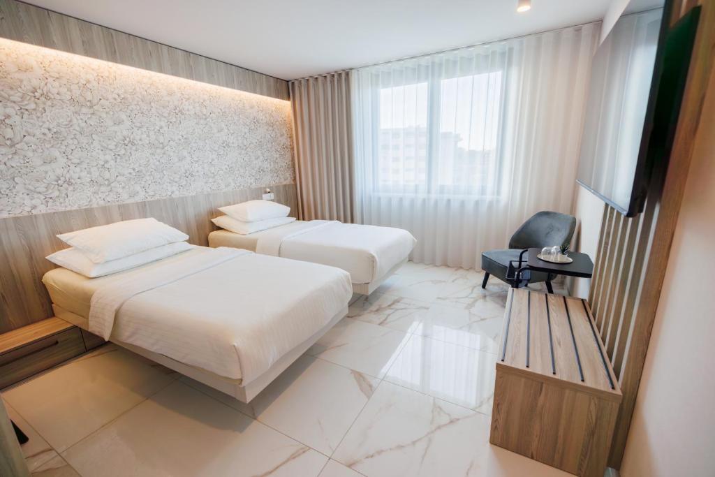 Postel nebo postele na pokoji v ubytování Hotel Capris Capodistria Boutique