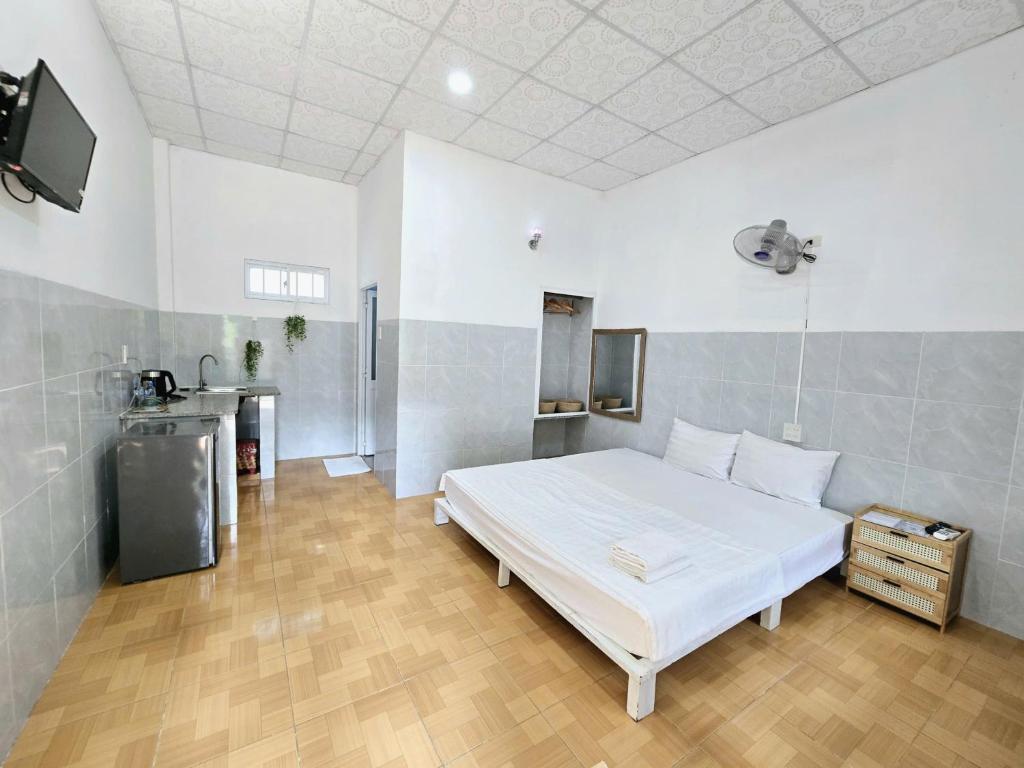 Giường trong phòng chung tại Lac House Mui Ne